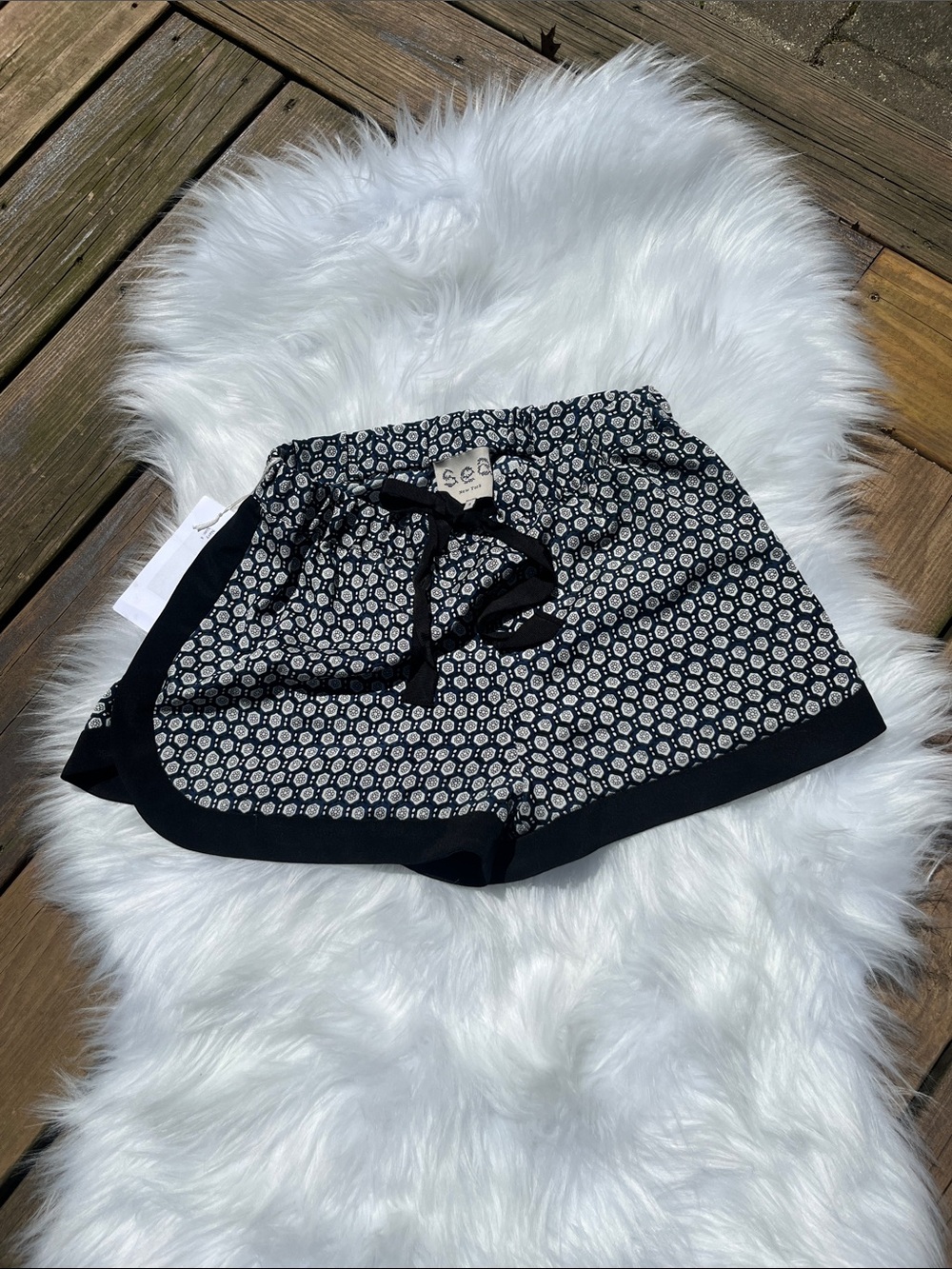 Black, white and navy high waisted printed women’s drawstring “track” shorts